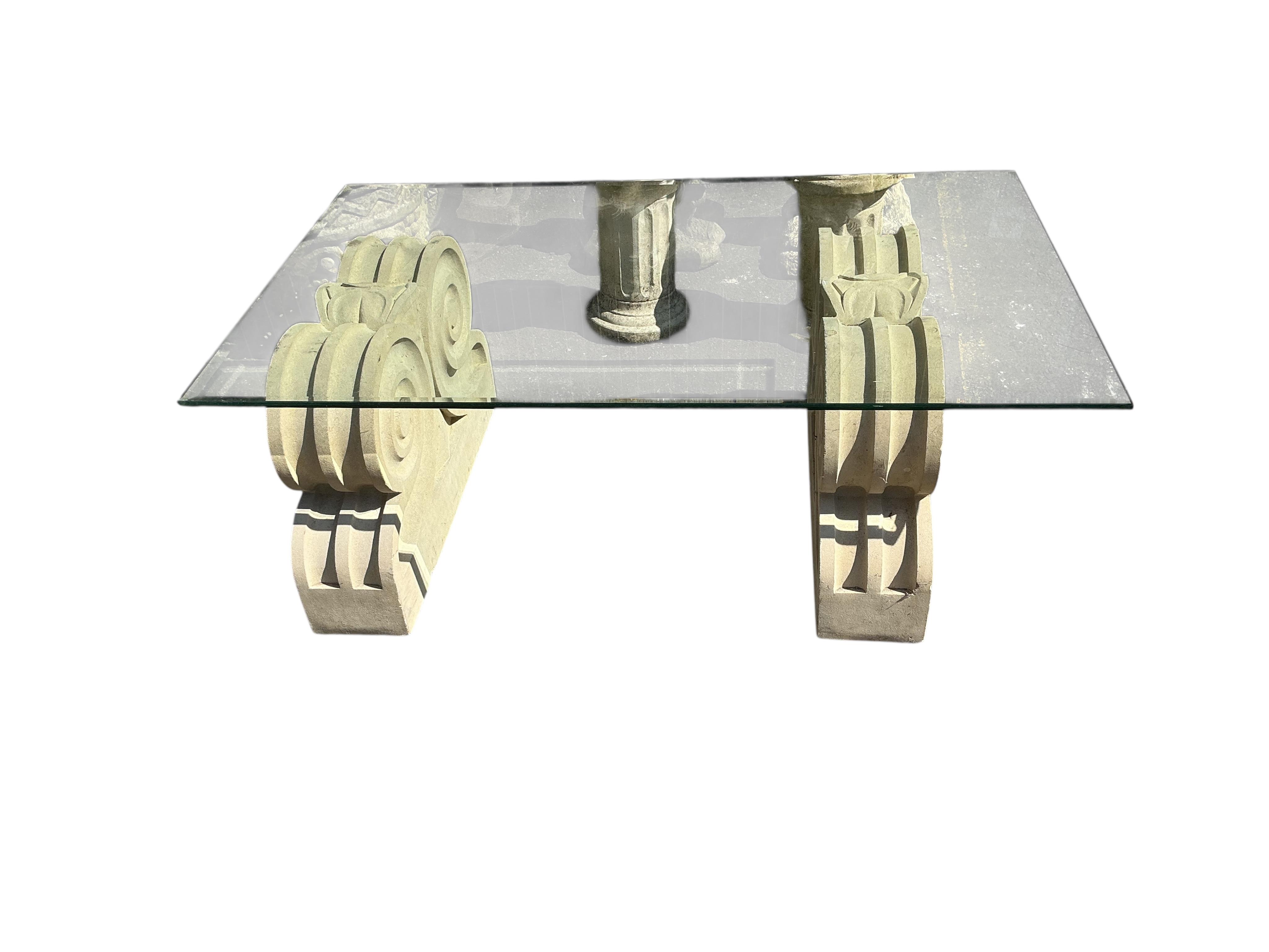 A reconstituted stone rectangular glass top garden table, width 117cm, depth 71cm, height 42cm